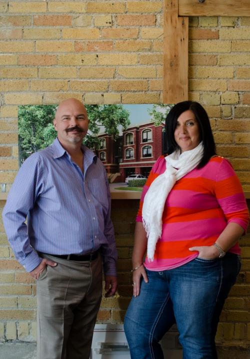 Fresh Projects President Sean Fehr and Vice President Janice Froese stand in front of plans to transform five buildings on Woodrow Place in the Wolseley area of Winnipeg. (Photo by Cole Breiland/ Winnipeg Free Press) Winnipeg Free Press