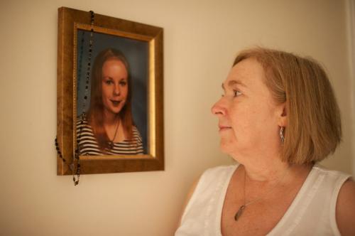 Elaine Stevenson holds a portrait of her daughter Alyssa with her rosary draped over  it that hangs in the family home on June 1st, 2012. Stevenson got the rosary from her grandmother, whom Alyssa was very close with. (Photo by Cole Breiland/ Winnipeg Free Press) Winnipeg Free Press
