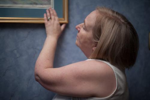 Elaine Stevenson touches a painting her daughter Alyssa made when she was happier and used colour instead of black and white.  A penciled note at the bottom right of the painting reads 'To Mom, Dad / I love you so much / Thank you for everything / Alyssa'.  (Photo by Cole Breiland/ Winnipeg Free Press) Winnipeg Free Press