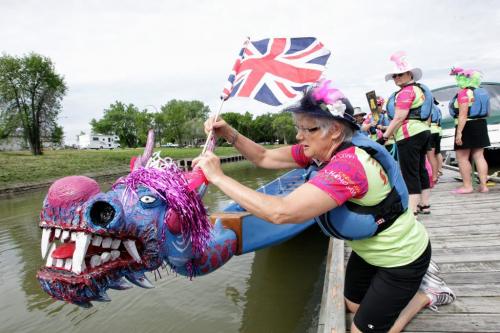 Marlene Roy puts the final touches on the dragon boat "Baby" before team Chemo Savvy sets off on their 11 km paddle on the Red River in honour of Her Majesty's Diamond Jubilee and the team's own 15-year history.  120603 June 3, 2012 Mike Deal / Winnipeg Free Press