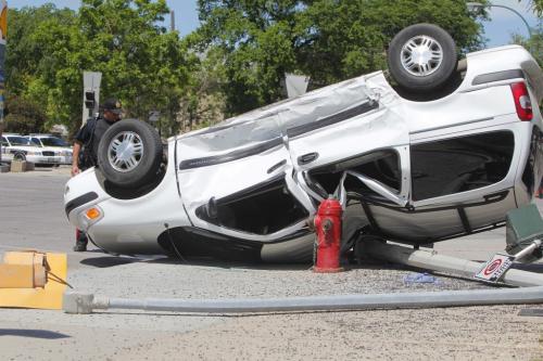 MVC roll over at the corner of Sherbrook and Portage Ave. June 5, 2012  BORIS MINKEVICH / WINNIPEG FREE PRESS