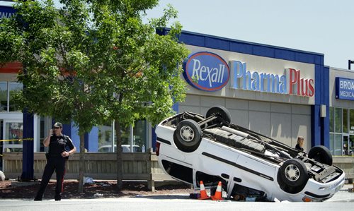 At least three people were sent to the hospital after a car and this minivan collided at Portage Avenue and Maryland Street mid-afternoon Tuesday. 120605 - Tuesday, June 05, 2012 -  (MIKE DEAL / WINNIPEG FREE PRESS)
