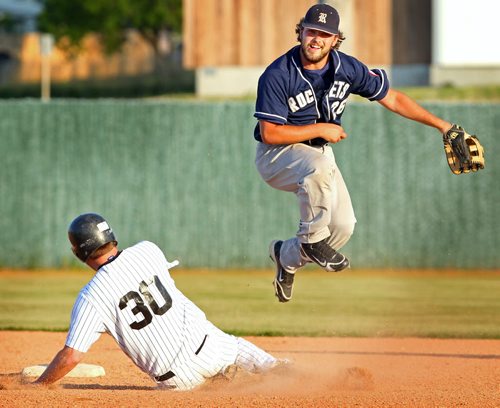 Brandon Sun Brandon Houstons Marlins' Cody Nevins is out at second as Reston Rockets' Mitch Olson makes good on the double play to first  during fourth inning MSBL action, Tuesday evening at Andrews Field. (Colin Corneau/Brandon Sun)