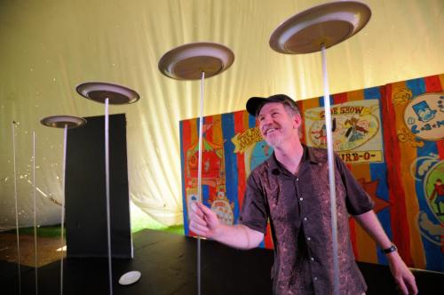 John Parks, the Funny Waiter, keeps plate five spinning after losing one and two while performing his spinning plate routine for media during a soundcheck for Kidsfest held in the Forks this weekend.  The event opens tonight and runs through Sunday (Photo by Cole Breiland / WInnipeg Free Press) WInnipeg Free Press