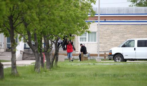 Outside shot of Southeast Collegiate at 1301 Lee Blvd where U of M prof  did test on 80 students for diabetes and used the same testing needle.  Now they have to be further tested.  Students hang outside the school. See Nick Martin Story. Ruth Bonneville Winnipeg Free Press