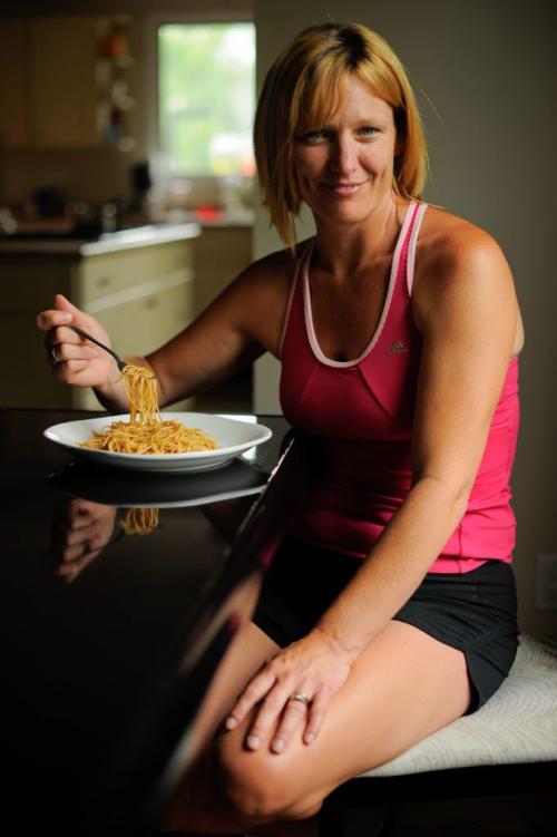 Kris Wood is about to begin carbing up for the upcoming Manitoba Marathon.  Wood prefers butter to sauce for her noodles.  Her pre-race snack will be a bagel, peanut butter, and bananas. (Photo by Cole Breiland / Winnipeg Free Press) Winnipeg Free Press