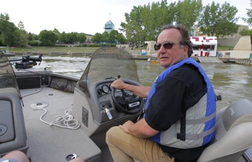 Deputy Mayor Justin Swandel in his boat at the forks. He took me and Bart on a river tour to show us what's going on the river. June 7, 2012  BORIS MINKEVICH / WINNIPEG FREE PRESS