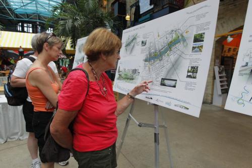 River City Connections at The Forks. They are showing a vision of river developement in Winnipeg. Here is a person from the public that is looking at the drawings. She agreed to be photographed but she prefered to not have her name used. June 7, 2012  BORIS MINKEVICH / WINNIPEG FREE PRESS