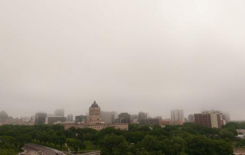 Fog and clouds hang over the Legislature Building and parts of downtown Winnipeg on Saturday morning. 120609 - Saturday, June 09, 2012 -  Melissa Tait / Winnipeg Free Press