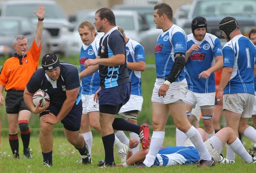 Brandon Sun Barbarian's Nathan Peto carries the ball through a pack of Winnipeg players to score during Saturday's rugby match at John Rielly  Field. (Bruce Bumstead/Brandon Sun)