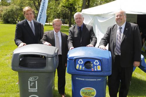 Nestle Waters Canada John B. Challinor II, CBCRA Exec. Dir. Ken Friesen, Gord Mackintosh, Minister of Conservation and Water Stewardship, and Councillor Russ Wyatt pose for a photo at the Recycle Everywhere press conference at Kildonan Park. June 12, 2012  BORIS MINKEVICH / WINNIPEG FREE PRESS