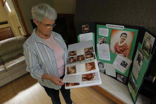 Sister Jo-Ann Duggan with some photos of Jocelyn Hutton, who would have been 50 years old if she had lived. Jocelyn House Hospice is a home where our family includes terminally ill residents in the final stages of life.  June 14, 2012  BORIS MINKEVICH / WINNIPEG FREE PRESS
