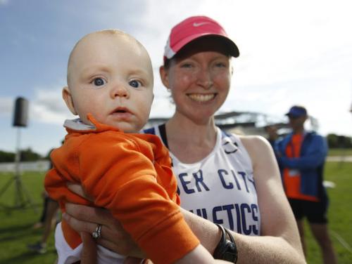 6 month old, Braedan Walker, with his mom, Darolyn, shortly after she finished second in the half marathon at the University of Manitoba during the Manitoba Marathon, Sunday, June 17, 2012. The pair were waiting for husband and dad, Brian, who would also finish second, but in the full marathon. (TREVOR HAGAN/WINNIPEG FREE PRESS)