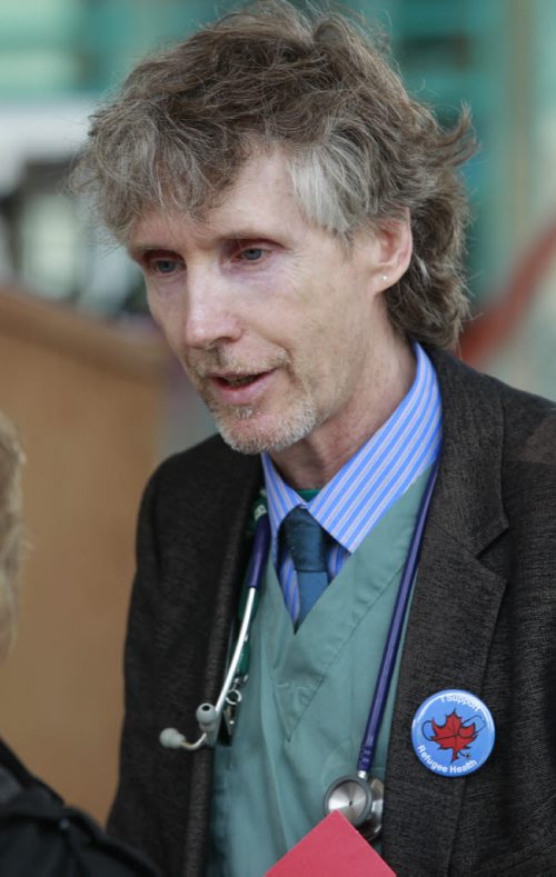 Dr. Michael Dillon, a Winnipeg family physician who has worked with newcomer refugees for nearly 20 years spoke at a demonstration at The Forks Monday to protest the federal governments decision to cut refugees health care coverage. For Carol Sanders  story    (WAYNE GLOWACKI/WINNIPEG FREE PRESS) Winnipeg Free Press  June 18 2012