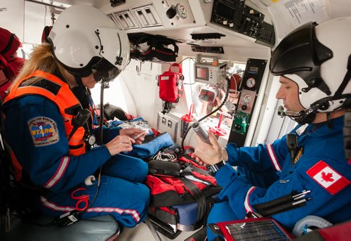 The STARS air ambulance medical team has little room to manoeuvre in the back of the helicopter. But flight nurse Rhonda Kaluzny (left) and flight paramedic Grant Therrien still have access to a large array of critical care equipment they would use on an a call. 120619 - Tuesday, June 19, 2012 -  Melissa Tait / Winnipeg Free Press