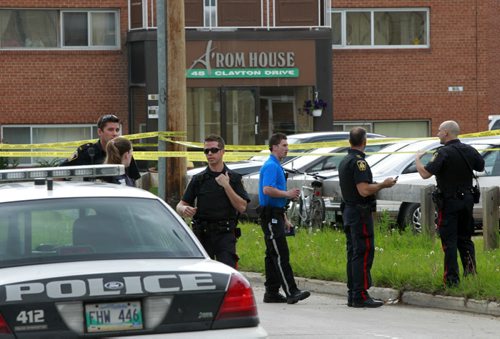 Winnipeg Police officers and cadets at taped off scene in the 100 block of Clayton Dr. (WAYNE GLOWACKI/WINNIPEG FREE PRESS) Winnipeg Free Press  June 20 2012. A woman who died after being stabbed in a parking lot in the St. Vital area this morning, June 20 2012 has been identified by friends as Kaila Tran. Police received a call just after 7 a.m. about an injured person in the 100 block of Clayton Drive this morning. This is Winnipeg's 17th homicide of 2012. Drake David Moslenko Treyvonne Willis