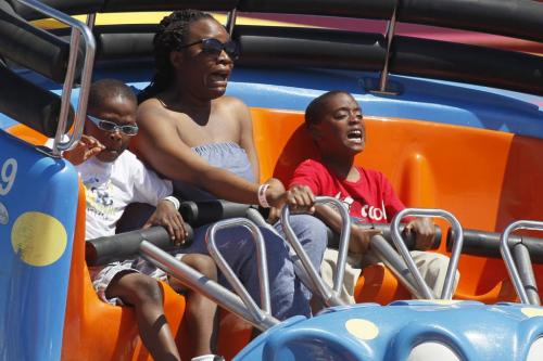 June 24, 2012 - 120624  -  Eleojo Audu (r), Itopa Momoh with their aunt Christi-Anna Durodola ride on the Crazy Mouse on the last day of The Ex Sunday June 24, 2012.    John Woods / Winnipeg Free Press