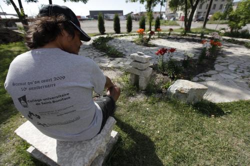 June 25, 2012 - 120625  -  Ronald Ross spends time in a memorial garden to murdered and missing women on Sutherland at Main which was built by Vineyard Church Monday, June 25, 2012.    John Woods / Winnipeg Free Press