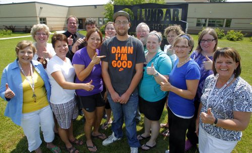 Neil Burnet of Lundar, MB graduated from Grade 12 last week having never misses a single day of school, from kindergarten to graduation. He was honoured with a special certificate. Here he poses with the teachers from the school. June 26, 2012  BORIS MINKEVICH / WINNIPEG FREE PRESS