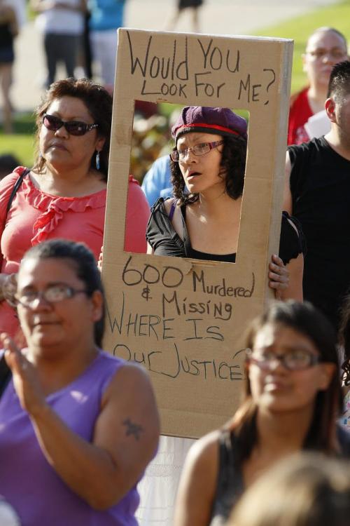 June 26, 2012 - 120626  -  Family and friends and supporters gather at a march and vigil for murdered and missing women in Canada at the Manitoba Legislature Tuesday, June 26, 2012.    John Woods / Winnipeg Free Press