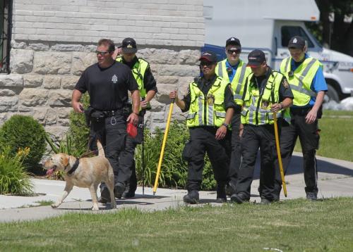 Police search for for evidence near Euclid and Sutherland. June 29, 2012  BORIS MINKEVICH / WINNIPEG FREE PRESS