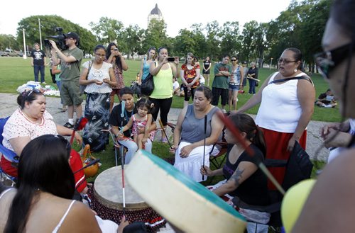 Drummers play at a vigil held for Carolyn Sinclair, Lorna Blacksmith and Tanya Nepinak, at Memorial Park, Saturday, June 30, 2012. (TREVOR HAGAN/WINNIPEG FREE PRESS)