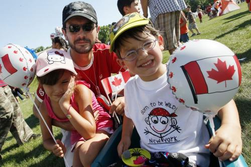 July 1, 2012 - 120701  -  J.P. Thone with children Alexandra and Gabriel, who were out celebrating Canada Day at Assiniboine Park, comment on their favourite things about Canada Sunday, July 1, 2012.    John Woods / Winnipeg Free Press