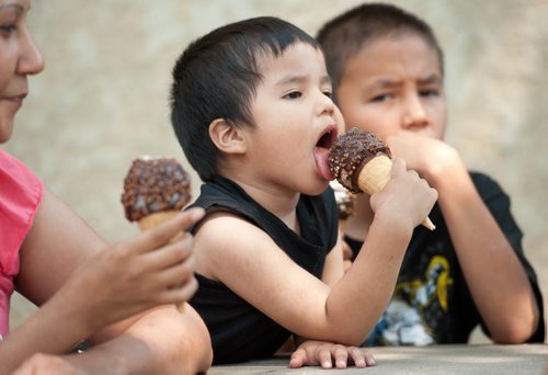 120702 Winnipeg - Sam mason takes a lick out of an ice cream cone on a hot and humid holiday Monday afternoon. WEATHER July 02 2012. COLE BREILAND / WINNIPEG FREE PRESS