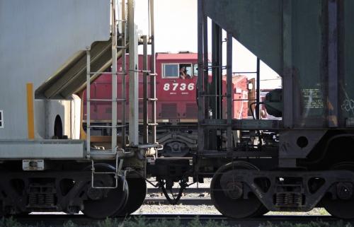 A CP train engine passes between the gap of some parked rail cars on the CP Rail Yards Tuesday morning. See Mary Agnes Welch story 120703 - Tuesday, July 03, 2012 -  (MIKE DEAL / WINNIPEG FREE PRESS)