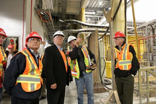 Dave Chomiak (left)  minister responsible for Manitoba Hydro and Preimer Greg Selinger get an explanation of the inner workings of the Wuskwatim station by construction manager Terry Armstrong (second from right) while minister Steve Ashton (right) watches.  The  Wuskwatim Generating Station located on the Burntwood River in northern Manitoba where the first of three generators went online. The station will provide around 200-megawatt's for the province and marks the first time Manitoba Hydro has fully partnered with a local First Nation. 120705 July 5, 2012 Mike Deal / Winnipeg Free Press