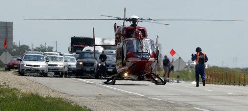 STARS  medical emergency helicopter  lands on Trans Canada Hwy 1 just east of Wpg -Motor Cycle vs pickup -  truck hauling a travel trailer was struck by a motorcycle  , STARS medical helicopter responded as well as rural ambluance and fire . Traffic is now moving around the mvc one lane east and west on the Trans Canada just east of  Wpg near Hwy 207,- not sure of how many injuries . STARS lifted off with an injured person on  stretcher  and an ambulance left the scene  with lights and siren going  KEN GIGLIOTTI  / WINNIPEG FREE PRESS  /  July 9 2012