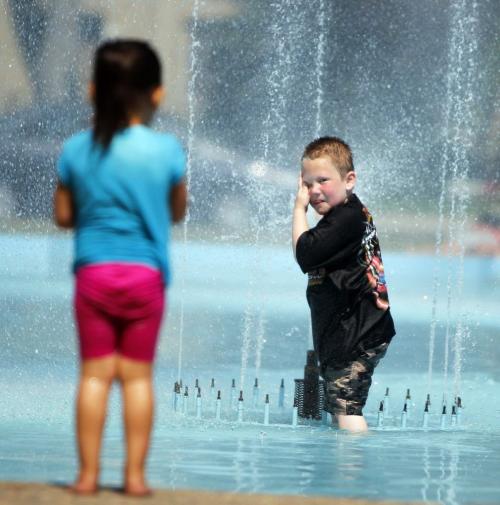 Memorial Park. Xander Lundgren ,6, enjoys the water in the heat. July 10, 2012  BORIS MINKEVICH / WINNIPEG FREE PRESS