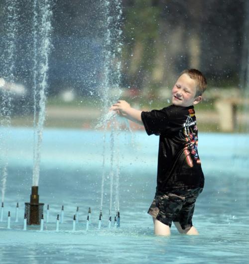 Memorial Park. Xander Lundgren ,6, enjoys the water in the heat. July 10, 2012  BORIS MINKEVICH / WINNIPEG FREE PRESS