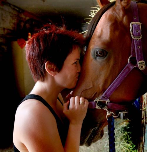 Young, up and coming,  female jockey Jennifer Reid  spends some quiet time at Assiniboia Downs stables with "Lake Sawyer" - the horse she won the Wheat City Stakes with during a winning streak last weekend. See Al Besson's story. July 11 2012, Ruth Bonneville Winnipeg Free Press