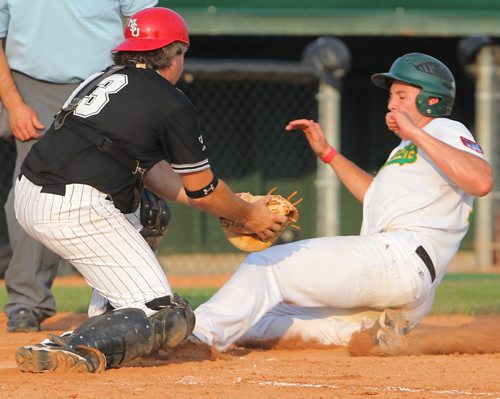 Brandon Sun Brandon Cloverleafs' Ryan Johnson is out at home as Marlins' catcher Kirck Graham makes the tag during MSBL action, Friday evening at Andrews Field. (Colin Corneau/Brandon Sun)