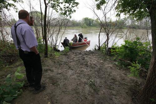 July 15, 2012 - 120715  - RCMP and residents of many Hutterite colonies search for eleven year old Becky Waldner in the Assiniboine River Winnipeg Sunday, July 15, 2012. On July 14, 2012 at about 8:00 p.m, Portage la Prairie RCMP and local emergency services were dispatched to search for the missing swimmer in the Assiniboine River near Poplar Point. John Woods / Winnipeg Free Press