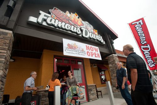 120716 Winnipeg - Customers packed the grand opening of the first Famous Dave's franchise in Canada at its Reenders Drive and Lagimodiere Boulevard location. Business Barbeque BBQ. July 16 2012. COLE BREILAND / WINNIPEG FREE PRESS