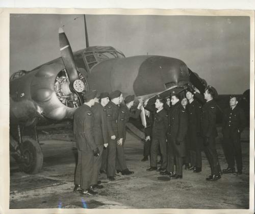 Winnipeg Free Press Archives Wartime Winnipeg  (02) A group of trainees look over a bombing plane on the opening day of the air  school at Winnipeg. (no date) fparchive