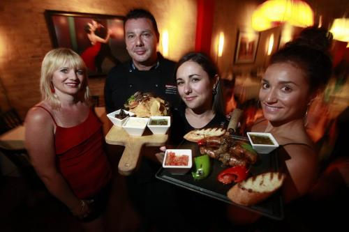 July 17, 2012 - 120717  -  Hermanos (L to R) Monique Gillan, chef Alfonso Muary, Sara Corrigan and Anna Klassen show off their Rib Eye Skewers and Sausage And Pepper Board Tuesday, July 17, 2012.  John Woods / Winnipeg Free Press