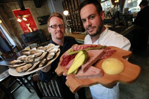 July 17, 2012 - 120717  -  Peasant Cookery general manager Richard Hanna (L) and chef de cuisine Chris Gama show off some House Made Charcuterie and Village Bay Oysters Tuesday, July 17, 2012.  John Woods / Winnipeg Free Press