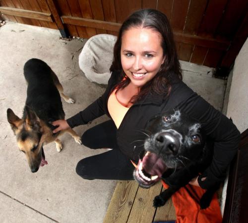 Yvonne Russell is launching an animal cruelty hotline. See here at home with her pooches Mike (left) and Garry. Paw Tipsters See Jennifer Ford's story. July 18, 2012 - (Phil Hossack / Winnipeg Free Press)