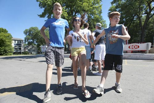 Windsor School Class of 2017 Grade seven students spend their last day of school going for ice cream to the BDI, signing year books and saying goodbye's to their grade eight classmates that are moving on to high school and Han an exchange student who is going home after spending a year with her classmates in Canada. See Doug Speirs story. Also see more photo's taken June 20. Names From left - Liam, Aby and Griffin do a little dance while waiting in a long line for icecream on their last day of school. June 29,  2012 (Ruth Bonneville/Winnipeg Free Press)