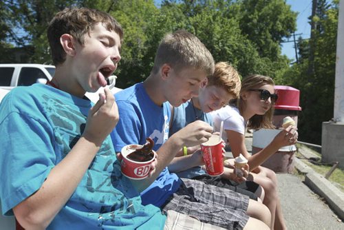 Windsor School Class of 2017 Grade seven students spend their last day of school going for ice cream to the BDI, signing year books and saying goodbye's to their grade eight classmates that are moving on to high school and Han an exchange student who is going home after spending a year with her classmates in Canada. See Doug Speirs story. Also see more photo's taken June 20.  Names from left -  Quinn, Liam,  Griffin and Aby cool themselves with some refreshing icecream frm the BDI on their last day of school. June 29,  2012 (Ruth Bonneville/Winnipeg Free Press)