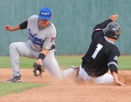 Brandon Sun Brandon Marlins' Nolan Jago is safe on a steal to second base as Oak River Dodgers' Gerlad Kuculym makes the catch during MSBL action, Friday evening at Andrews Field. (Colin Corneau/Brandon Sun)