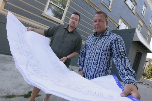 July 22, 2012 - 120722  -  Jeff Eales (L), General Manager for Wintec Building Services and Mike Romani, Wintec's President look at drawings in front of  540 Maryland Sunday, July 22, 2012. Wintec is developing Westend properties. John Woods / Winnipeg Free Press