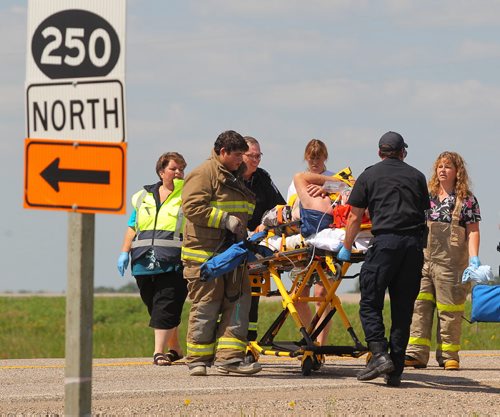 Brandon Sun Emergency crews tend to a driver injured in a mishap near the junction of Highway 270 and Highway 25, Monday afternoon. FULL DETAILS TO BE CONFIRMED BY POLICE (Colin Corneau/Brandon Sun)