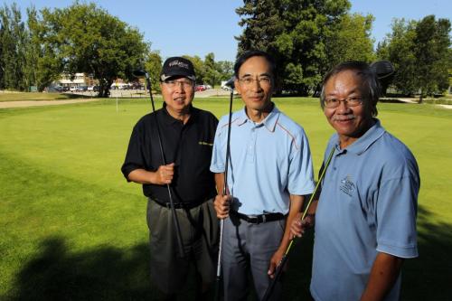 Chinese golfers Garry Eng, Humphrey Yung, and Joe Chung pose for a photo at Wildwood Golf course.  July 24, 2012  BORIS MINKEVICH / WINNIPEG FREE PRESS