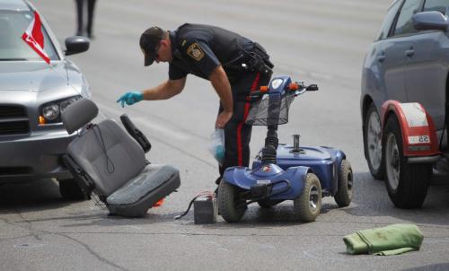 A pedestrian was taken to hospital late this morning following a collision with a vehicle at Portage Avenue and Rouge Road. A police release just before 1 p.m. calls the collision 'a serious motor vehicle collision involving a pedestrian.'  July 24, 2012  BORIS MINKEVICH / WINNIPEG FREE PRESS