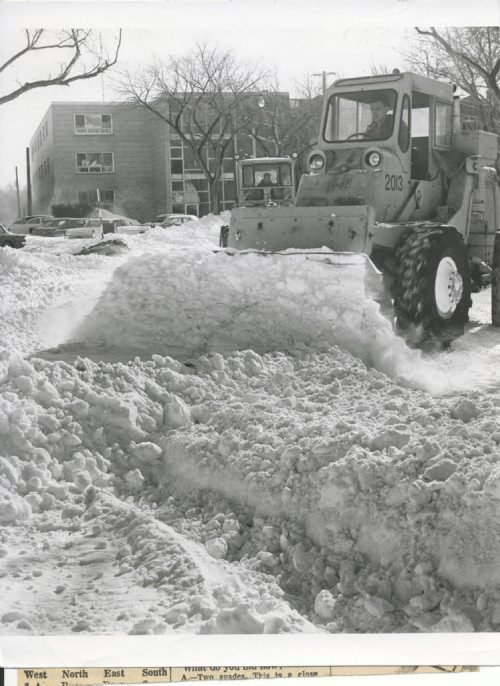 Gerry  Cairns/Winnipeg Free Press Archives Winnipeg Blizzard (4) March 5, 1966 A  grader with a front end loader takes a stab at clearing Balmoral Street. Winter storm, March 4, 1966 fparchive