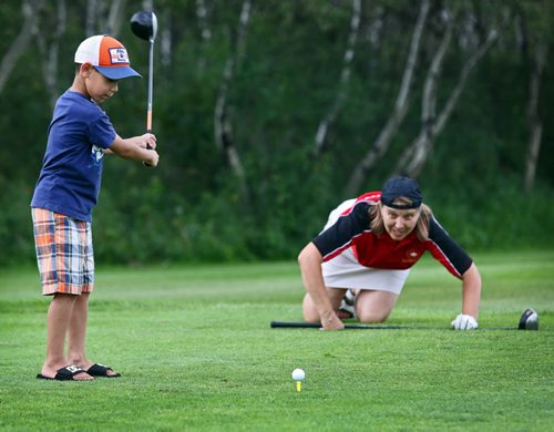 Brandon Sun Dwayne Oman tees off with close family friend Roz Evason during a charity golf tournament, Saturday afternoon at the Shilo Golf and Country Club. The tournament, held in honour of Roz' late husband Dan (popularly known as "Heavy"), raised tens of thousands of dollars for the Special Olympics and is the final one to be held in his memory. (Colin Corneau/Brandon Sun)